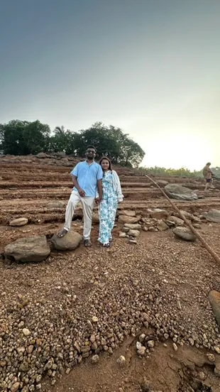 The two of us on red earth steps at sunset